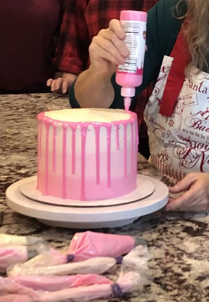 adding the drip to an ombre cake