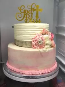 pink and white texturing on communion cake