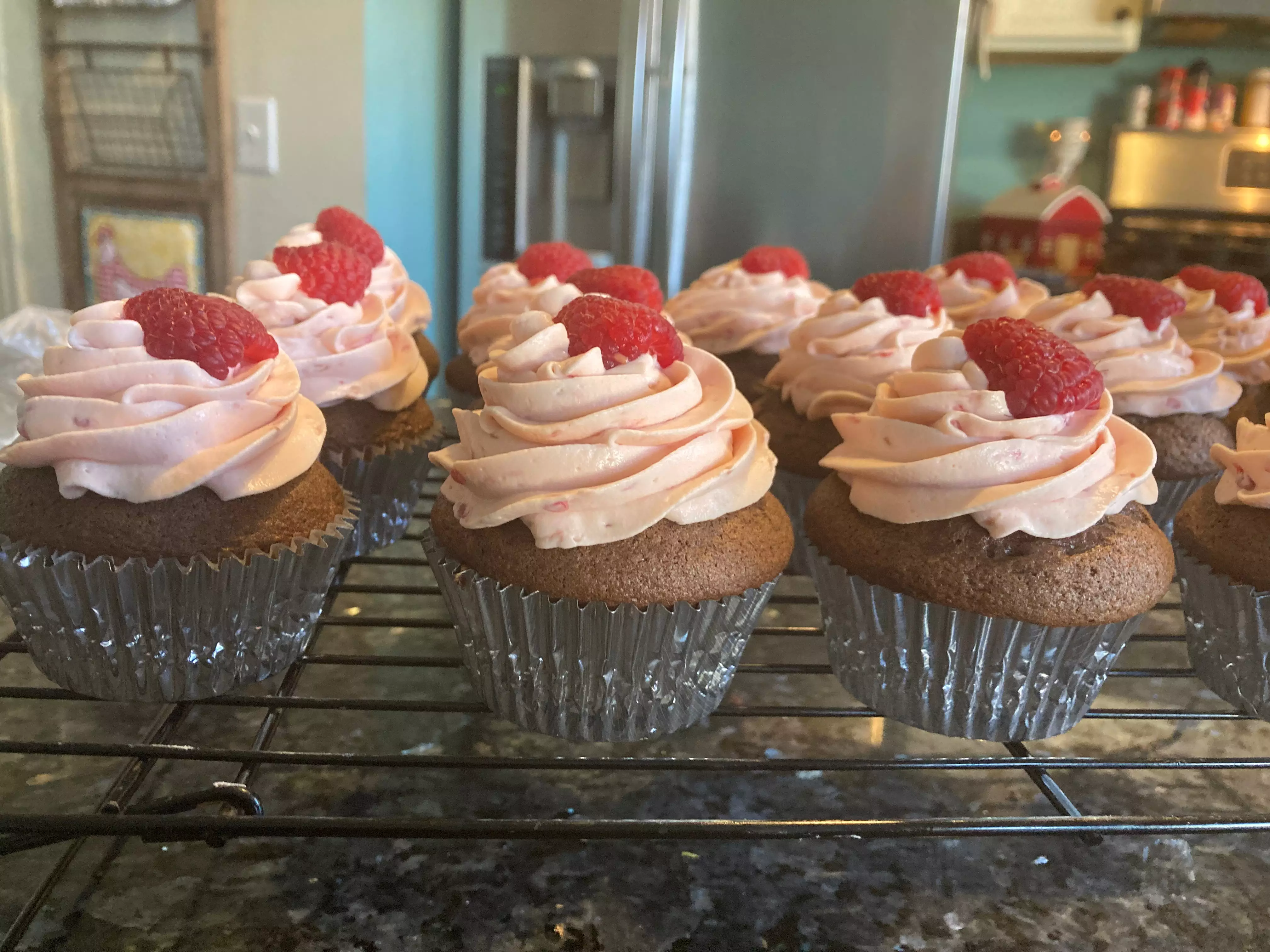 chocolate cupcake with raspberry whipped cream frosting