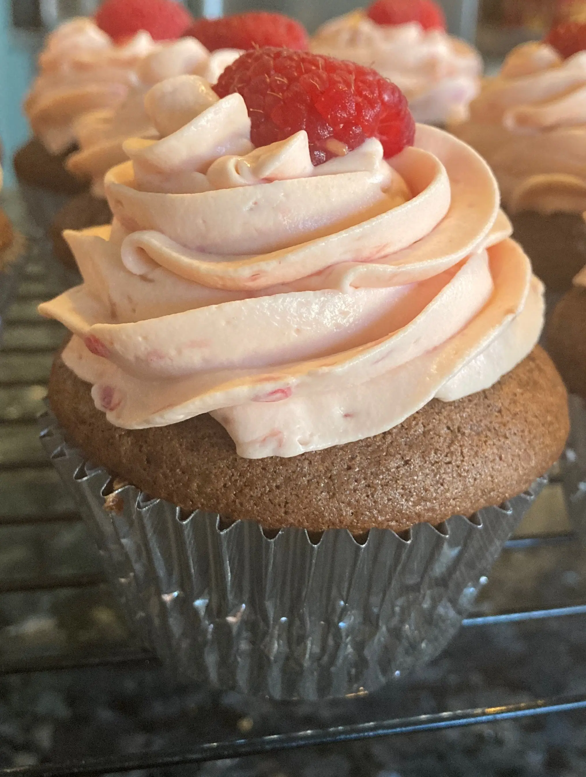 chocolate cupcake with raspberry whipped cream frosting