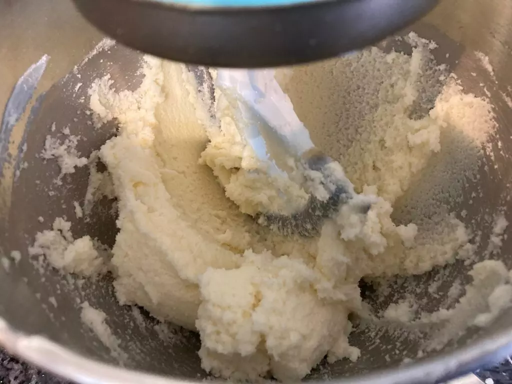 butter, sugar, and vanilla mixed in mixing bowl