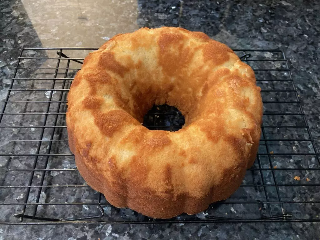 baked pound cake out of pan and cooling