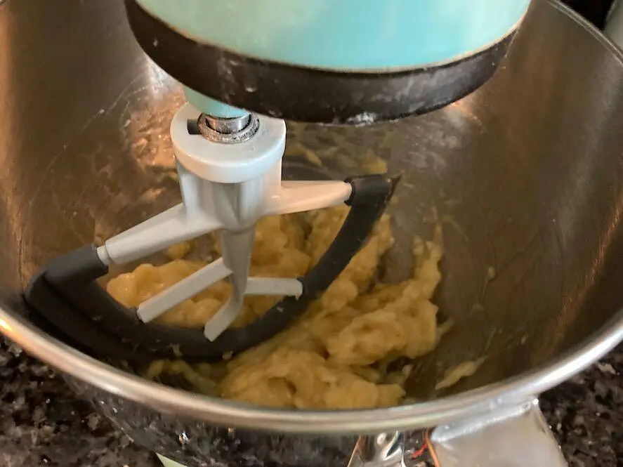 mashed bananas in mixing bowl