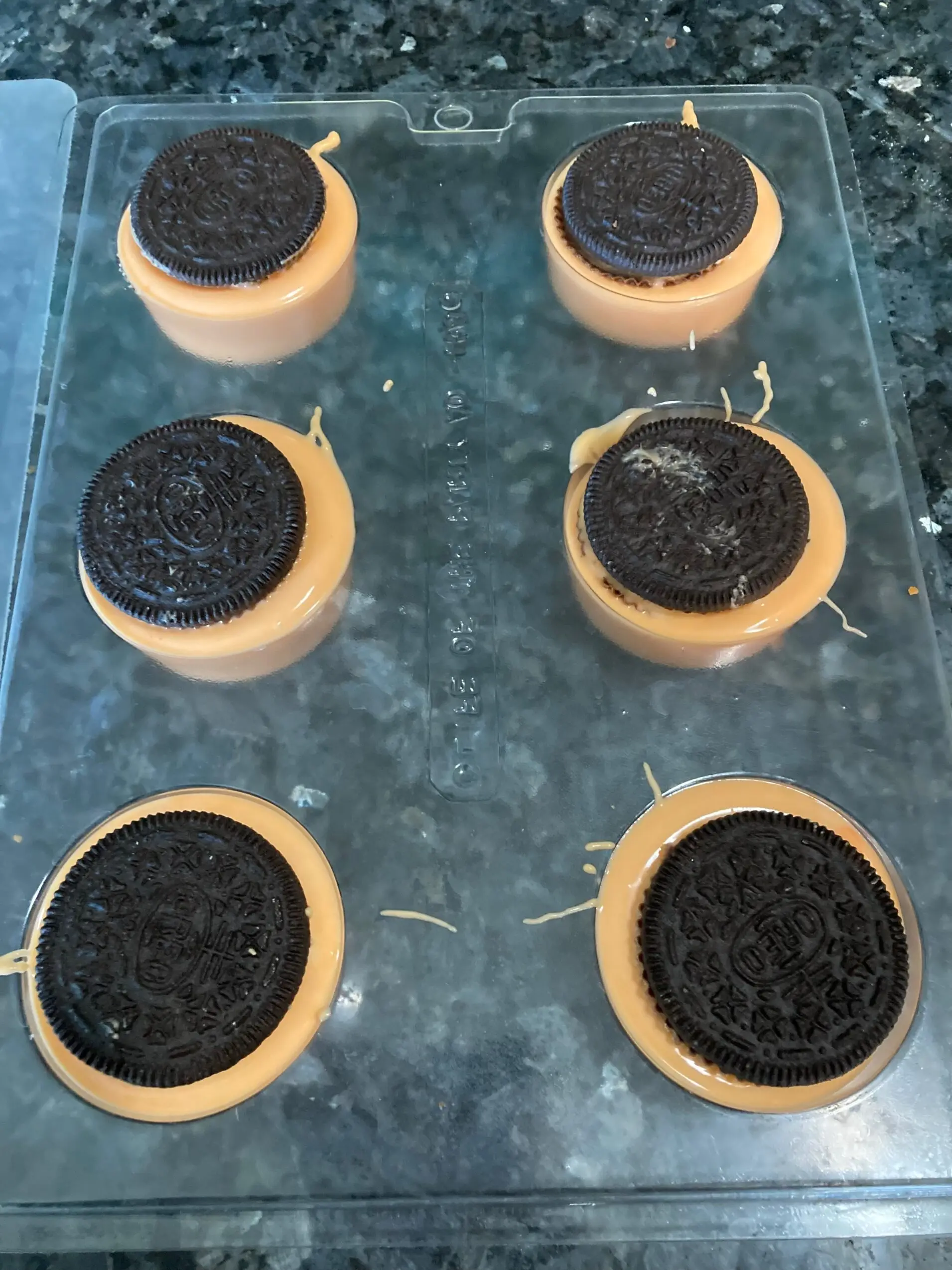 Oreos in melted chocolate in mold