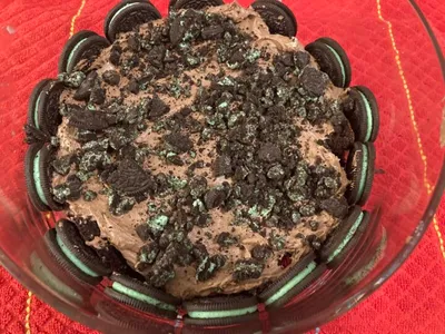 laying the trifle with crushed mint Oreos on top