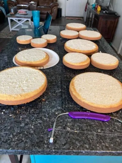 layers of leveled white cake before stacking