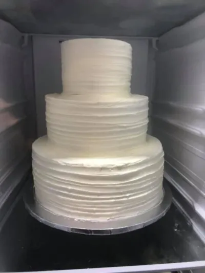 three tiered white wedding cake, textured
