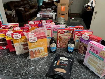 Picture of more than a dozen cake mixes including Dolly Parton cake mix, coconut flavor