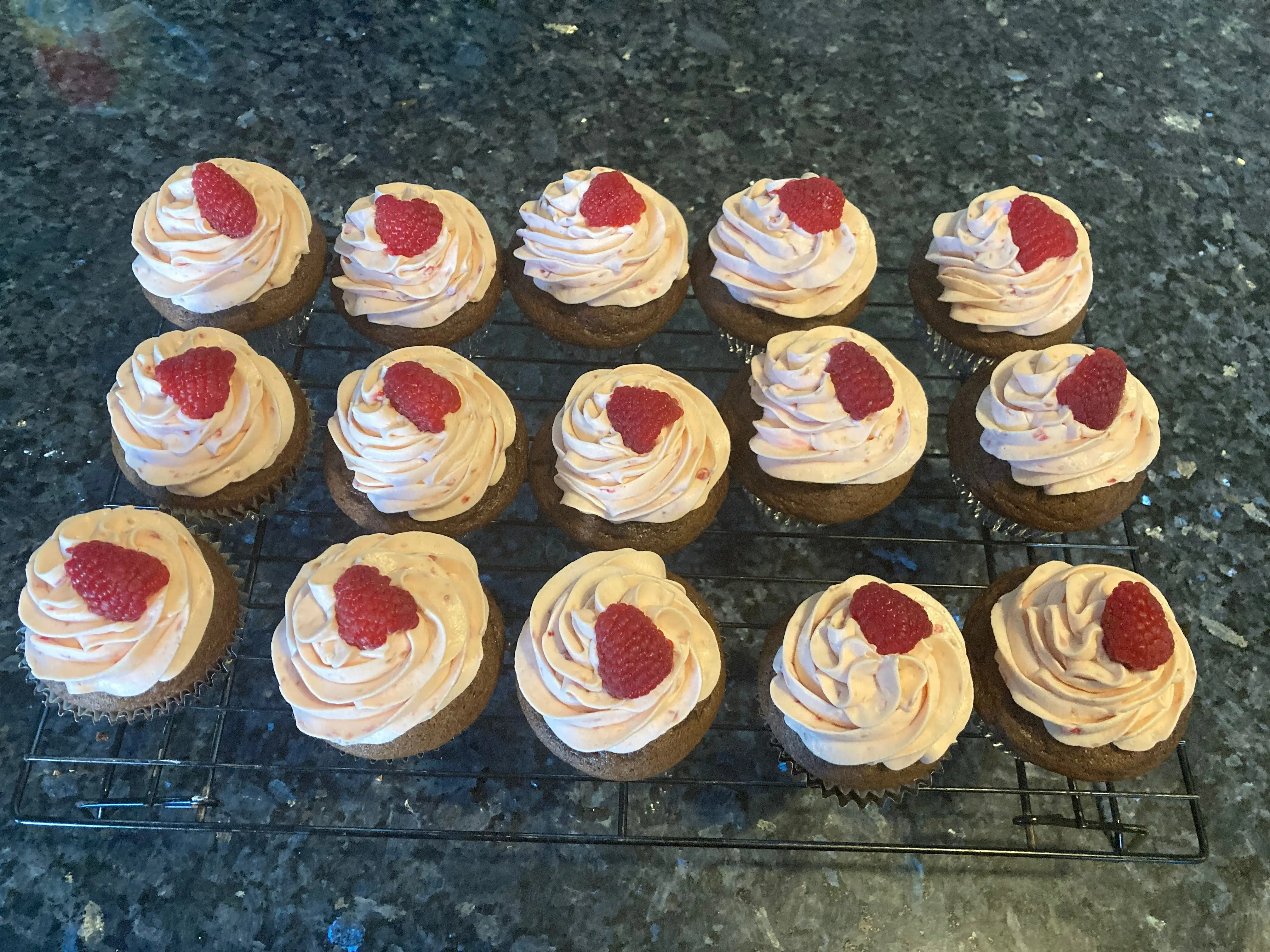 chocolate cupcake with raspberry whipped cream frosting