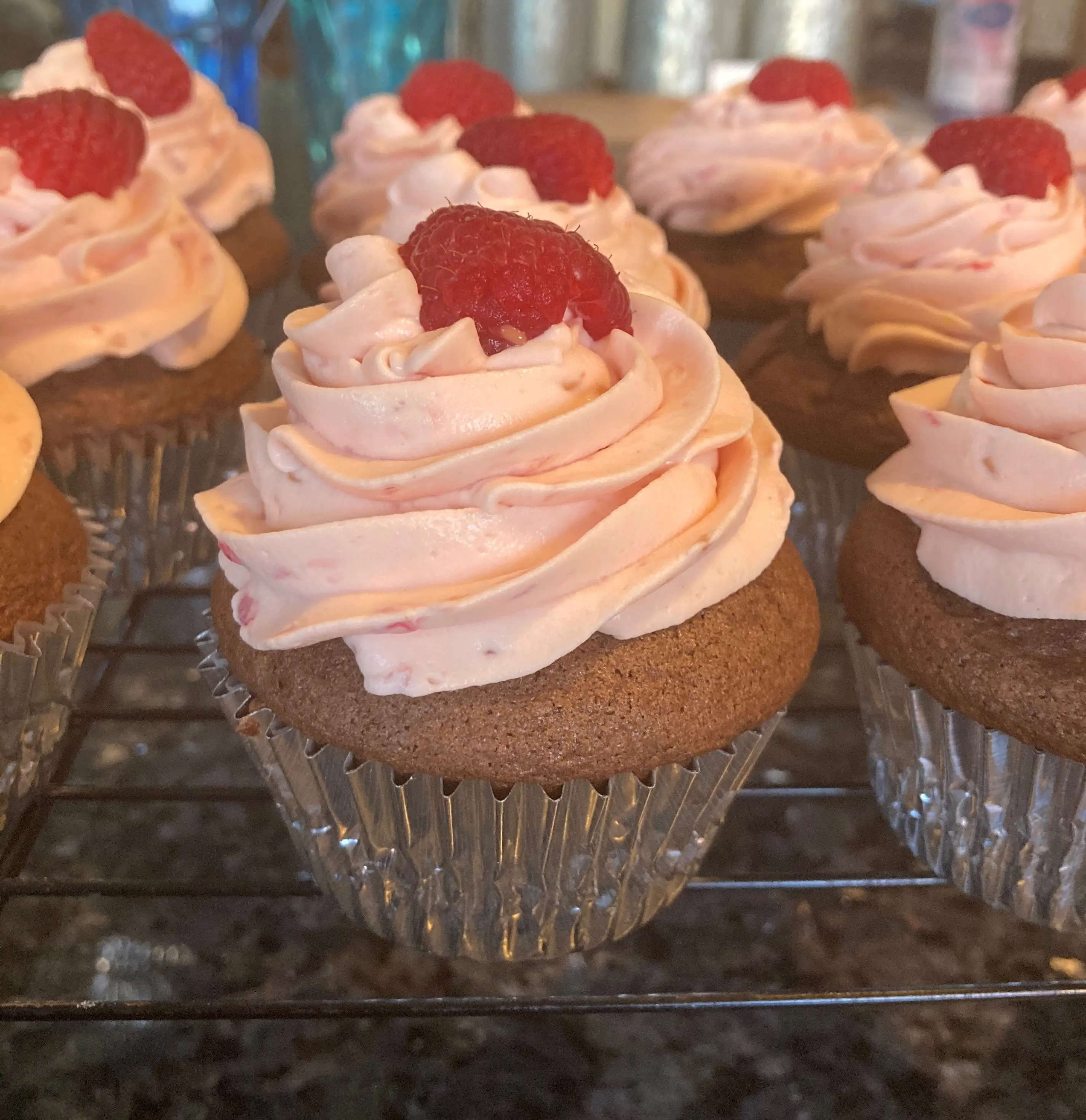 chocolate cupcake with raspberry whipped cream frosting