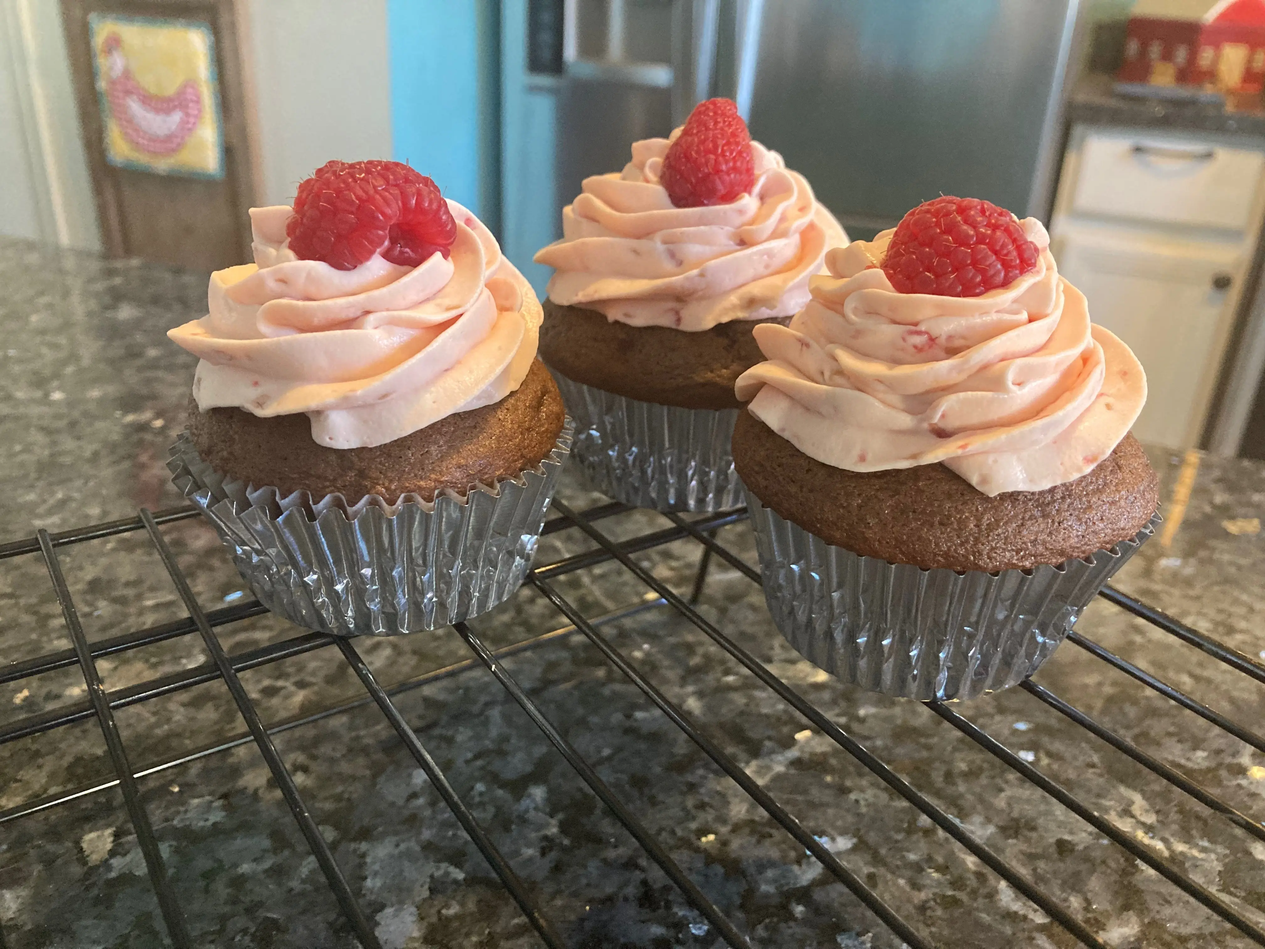 chocolate cupcake with raspberry whipped cream frosting