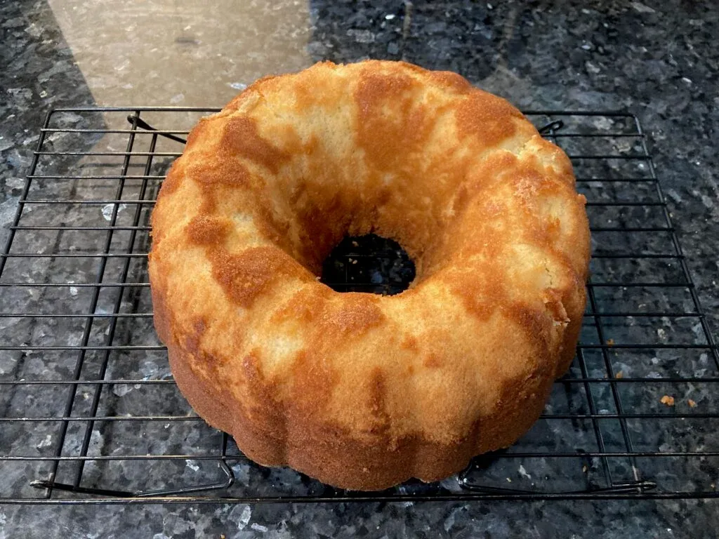 baked pound cake out of pan and cooling