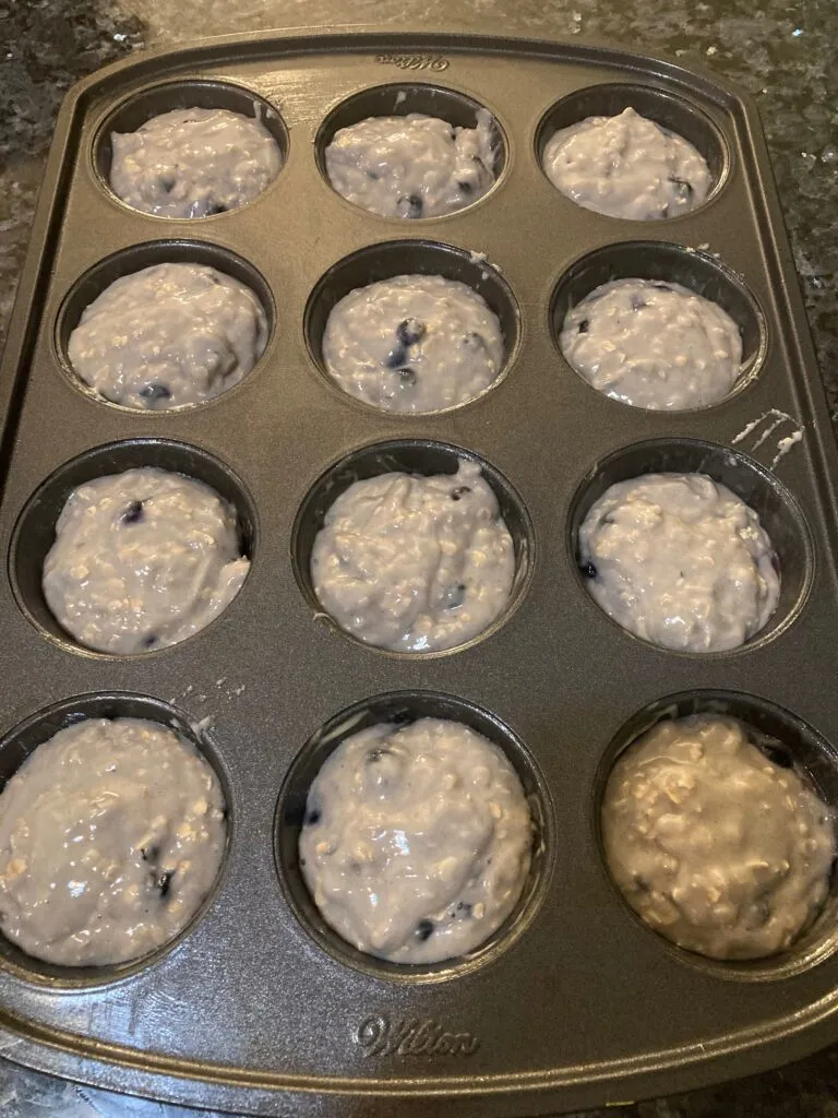 Blueberry muffin batter in cupcake pan