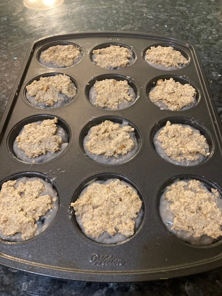 Blueberry muffin batter with streusel topping