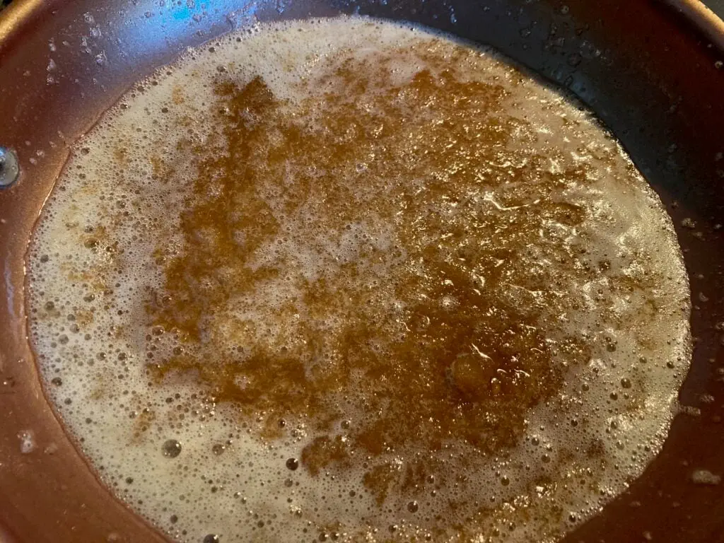 skillet with melted butter and brown sugar