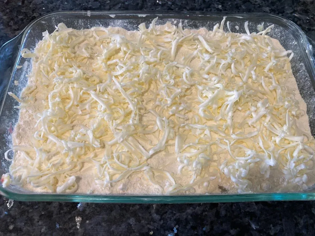grated butter on top of dry cake mix
